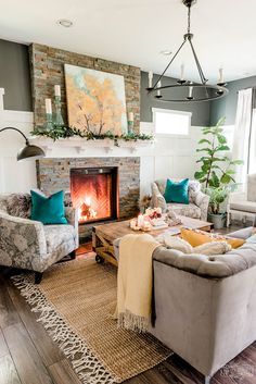 a living room with two couches and a fire place in the middle of it