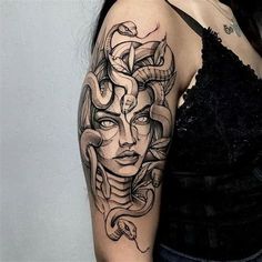 a woman's arm with a tattoo on it and a snake around her head