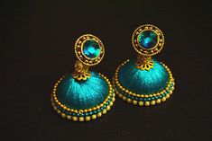 *****The price mentioned is for a pair of jhumkas***** Well designed and ornated silk thread jhumkas that come in various colors, color combinations, patterns and designs. I can try and make the designs to your liking if you specify a specific color or design pattern. As I can make these Trending Outfits