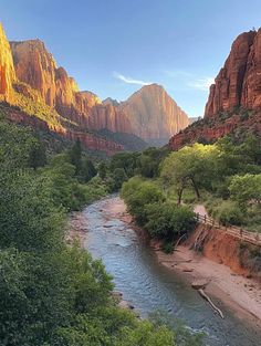 a river flowing through a lush green forest covered hillside next to tall red mountains in the distance