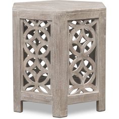 the side table is made out of wood and has an intricate design on it's sides