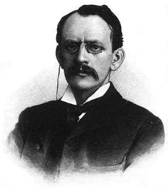 an old black and white photo of a man in glasses with a mustache on his head