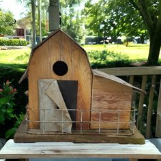 a bird house made out of wood and wire