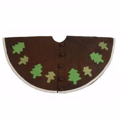 a brown and green bib with trees on it