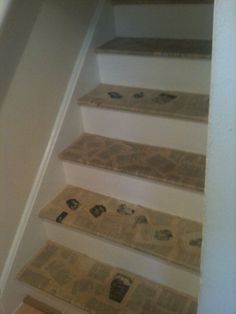 there is no image here to provide a caption for in this case, the stairs are covered with newspaper