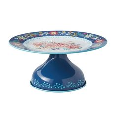 a blue cake plate sitting on top of a table