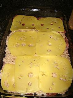 a casserole dish with cheese and meat in it