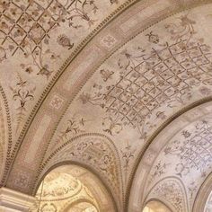 the ceiling is decorated with intricate designs