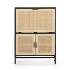 the sideboard with rattan doors and black frame is shown in front of a white background