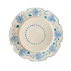 a blue and white plate with flowers on the rim, sitting in front of a white background