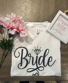 Bride tshirt!! Custom bride tshirt for bridal shower, Bach , and wedding!! White custom bride shirt for bride!! Please feel free to message me if interested in a custom design. Shirt is 100 % polyester All shirts are unisex (they do run a little bigger) Size down if like a tighter fit, stay true to size if you would like a loose fit White Bridal T-shirt With Short Sleeves, White Custom Text Top For Wedding, White Custom Text T-shirt For Weddings, White Custom Print T-shirt For Bachelorette Party, White T-shirt For Bridal Shower Short Sleeve, White Short Sleeve T-shirt For Bridal Shower, Wedding T-shirt With Custom Print And Short Sleeves, Custom Print Short Sleeve T-shirt For Wedding, White Short Sleeve Bride T-shirt