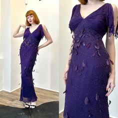 Vintage 2000s Dress / Y2K Diane Freis Beaded Feather Gown / Purple ( small S ) ~T H E R U N D O W N~ Modern Size: S Materials: 100% silk  Condition: Excellent vintage condition, deadstock with original tags attached Brand: Diane Freis ~F U L L D E T A I L S~ From our exclusive deadstock Diane Freis collection! These came directly from the designer's vintage backstock and have been untouched for the last 30 years! Stunning Y2K dark purple silk gown with intricate beading and hand-sewn feather details throughout. V neckline with pleating on the padded bust, delicate butterfly sleeves with teardrop beads and  curve-hugging bias cut. Zipper closure at the side, fully lined. ~ M E A S U R E M E N T S~ Bust: 32-38 inches Waist: 26-34 inches Hips: Up to 40 inches Length Shoulder to Hem: 58 inches Purple Silk Gown, Vintage Purple Dress, 2000s Dress, Gown Purple, Feather Gown, Beaded Feather, Diane Freis, Prom Dress Inspo, Dresses 40s