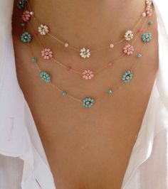 a close up of a woman's stomach with multi colored flowers attached to it