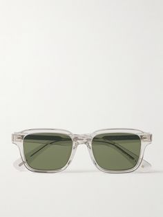 Oliver Peoples' square-frame 'Errisson' sunglasses have been made in Japan from thick, clear acetate and fitted with classic green lenses. The silver-tone metal wirecore, visible along the arms, is etched with custom filigree. Oliver Peoples Glasses Mens, Clear Frame Sunglasses, Clear Sunglasses Frames, Transparent Sunglasses, Oliver Peoples Sunglasses, Oliver Peoples Glasses, Green Lenses, Clear Frames, Acetate Sunglasses