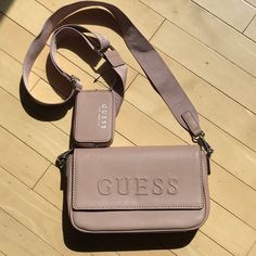 This Adorable Guess Cross Body Shoulder Bag Is In Excellent New Condition Without Tags.- Solid Dusty Pink. Web Fabric Removable Shoulder Strap With The Guess Name. Inside Has Zippered Pocket And Credit Card Slots. Slash Pocket On Back Too. Measures: 9.5” Wide X 6” High X 2.25” Deep. May Have Been Purchased At A Factory Outlet. Comes From A Smoke Free And Pet Free Home. So Cute And Ready To Wear. Guess Sling Bag, Pink Cross Body Bag, Guess Shoulder Bag, Guess Bag, Slash Pocket, Pink Cross, Guess Purses, Alligator Print, Guess Handbags