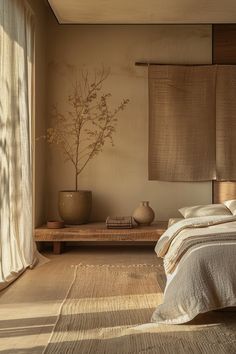 a bed sitting in a bedroom next to a window