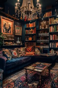 a living room filled with lots of furniture and bookshelves covered in paintings on the walls