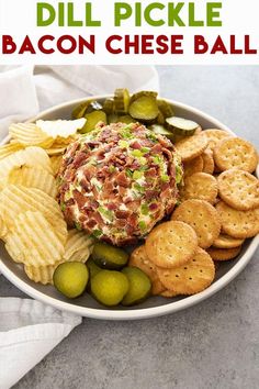 a bowl filled with bacon cheese ball surrounded by crackers and pickles