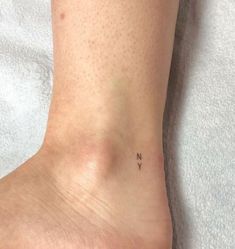 a person with a small tattoo on their foot