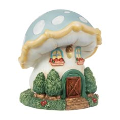 a ceramic mushroom house with a door and windows