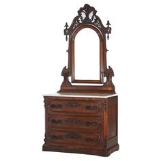 an ornate wooden dresser with mirror on top