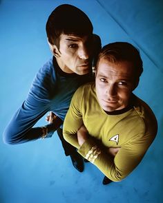 two men in star trek costumes posing for a photo