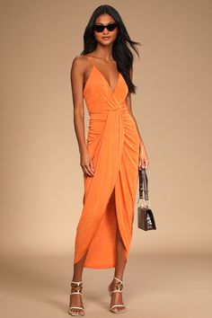 Show up fashionably late in the Lulus Dreamy Date Orange Surplice Midi Dress! Textured stretch knit, with a bit of sheen, shapes this must-have dress that falls from adjustable straps (that crisscross in back) into a surplice neckline and a lightly gathered bodice. A fitted waist tops a draping midi skirt that creates a stunning silhouette before ending at a tulip hem. Fit: This garment fits true to size. Length: Knee to mid-calf length. Size medium measures 46.5" from adjustable straps to hem. Honeymoon Fashion, Destination Wedding Guest Dress, Orange Bodycon Dress, Orange Midi Dress, Stretch Knit Dress, Summer Wedding Outfits, Lulus Dresses, Tulip Dress, Wedding Guest Dresses