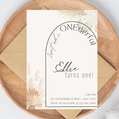 a card with the words onederful on it and an envelope next to some flowers