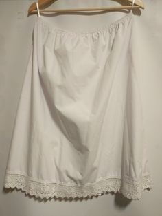 50% cotton , 50 % polyester With beautiful heart lace White Delicate Lace Skirt For Summer, Chic White Skirt With Lace Patchwork, Elegant Summer Skirt With Lace Patchwork, Chic Lace Skirt With Lace Trim, Lace Skirt With Lace Work, Delicate Lace Skirt For Spring, Stretch Cotton Tiered Skirt, Fitted Summer Skirt With Delicate Lace, Summer Fitted Skirt With Delicate Lace