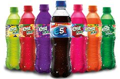 six bottles of soft drinks are lined up in a row, each with different flavors