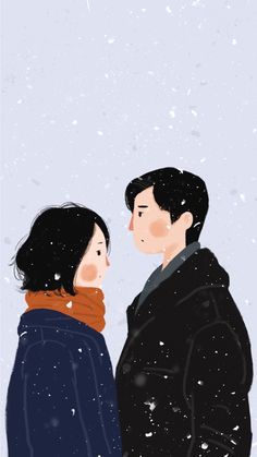 two people standing next to each other in the snow