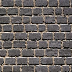 an image of a brick wall that looks like it could be made out of cement