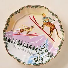 a decorative plate with an image of two skiers