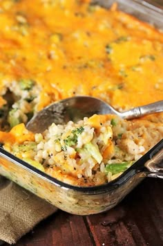 a casserole dish with broccoli, rice and other vegetables in it