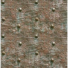 an upholstered fabric with small dots on it