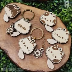 wooden keychains with cartoon cats on them