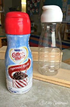 a bottle of coffee next to a container of liquid