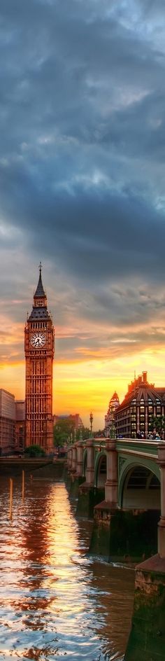 the big ben clock tower towering over the city of london, england at sunset or dawn