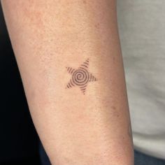 a person with a tattoo on their arm