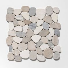 a pile of rocks sitting on top of a white surface