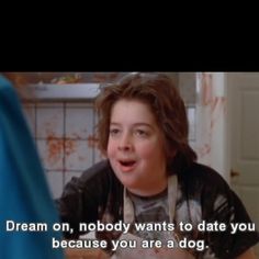 a woman talking to a man in a kitchen with the caption dream on nobody wants to date you because you are a dog