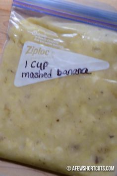 a bag of mashed banana sitting on top of a wooden table