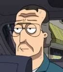 an animated man with glasses driving in a car