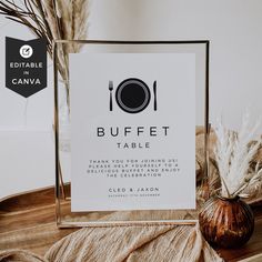 the buffet table sign is placed next to a vase with pamodia in it