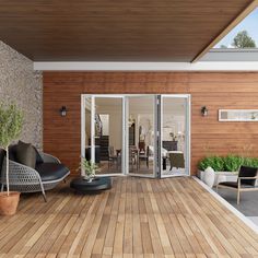 an outdoor living area with wood flooring and sliding glass doors