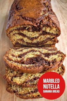 a loaf of chocolate swirl bread sitting on top of a wooden cutting board