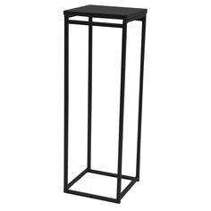 a black metal plant stand on a white background