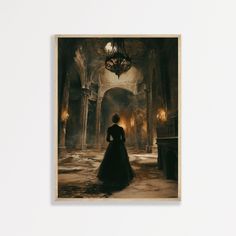 a woman in a long dress is looking at a chandelier