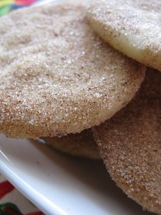 some sugar cookies are on a white plate