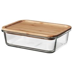 a glass casserole with a wooden lid